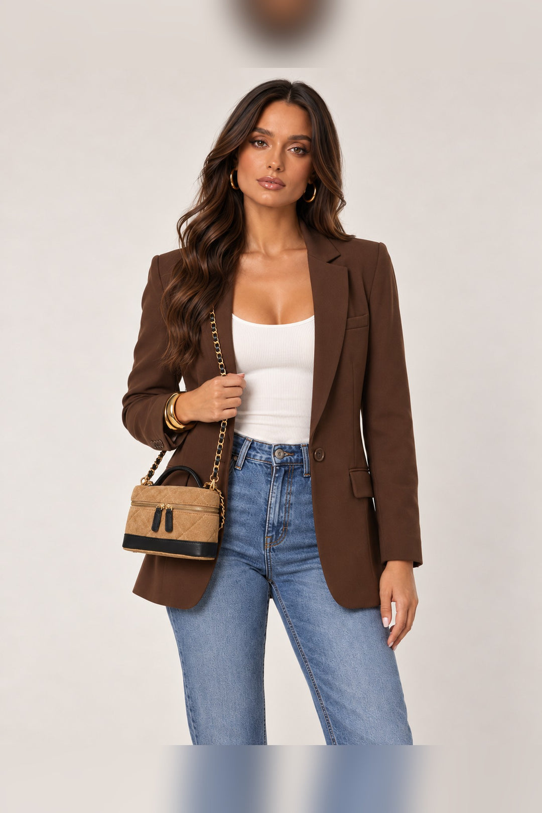 Novalee crossbody worn on the shoulder by its removable chain strap