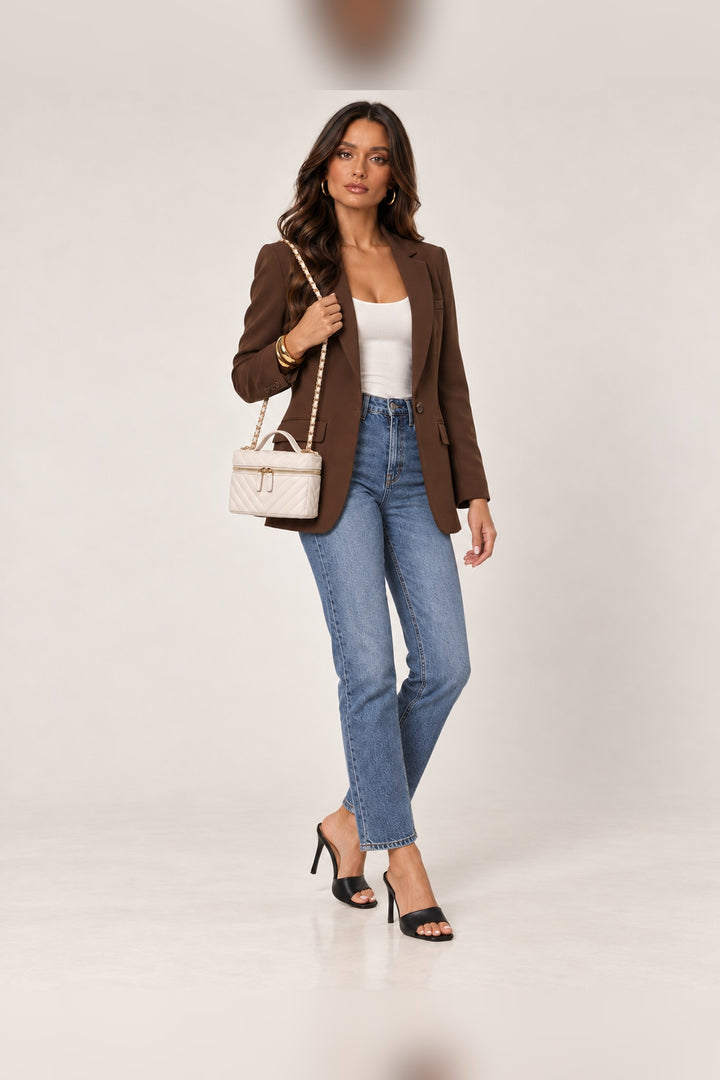 Ivory chevron-quilted Sella crossbody styled with a full-length outfit