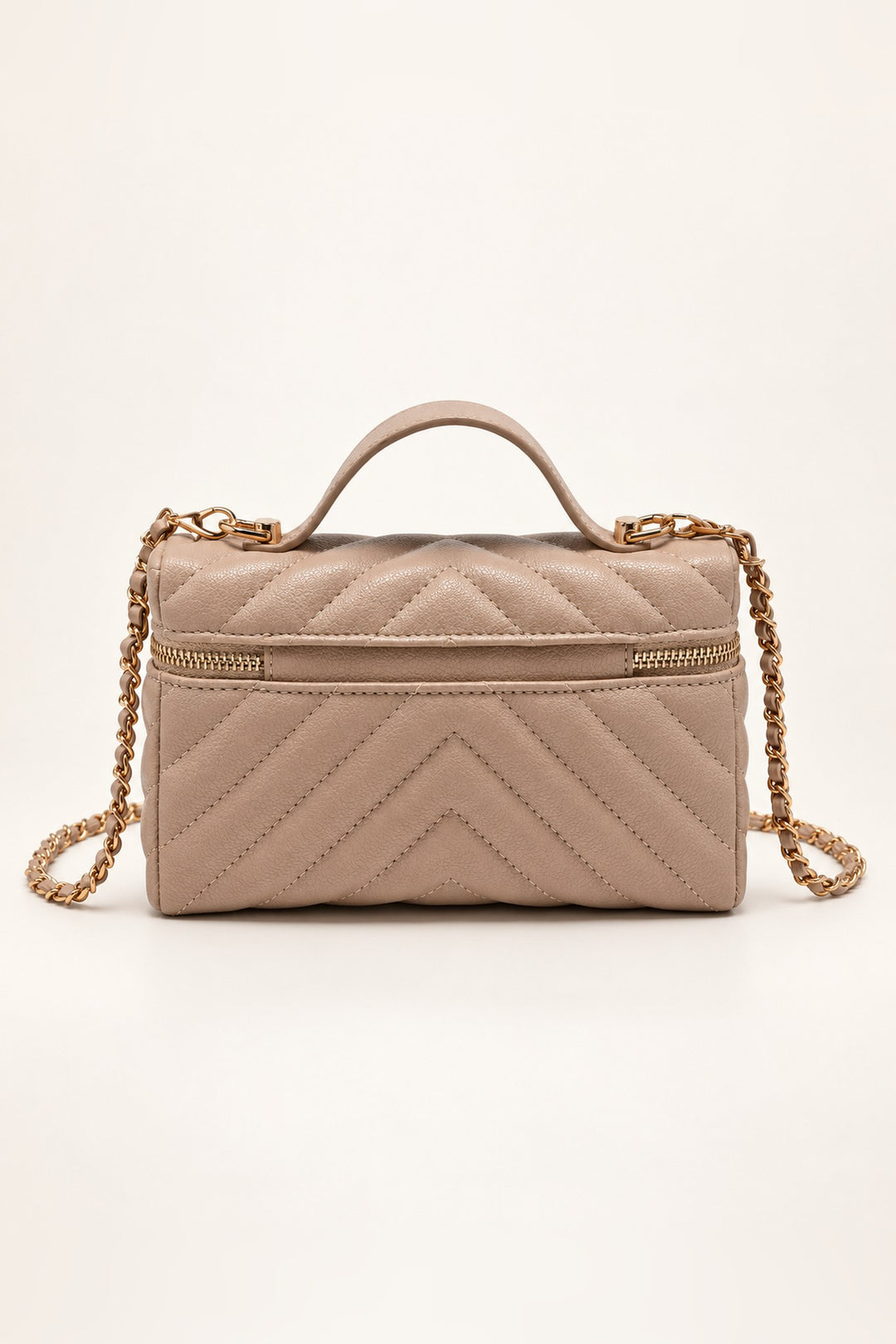 Back of the beige chevron-quilted Sella crossbody in pebbled vegan leather
