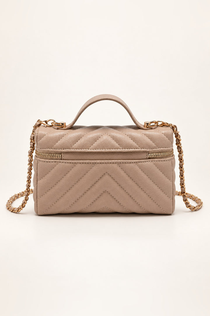 Back of the beige chevron-quilted Sella crossbody in pebbled vegan leather