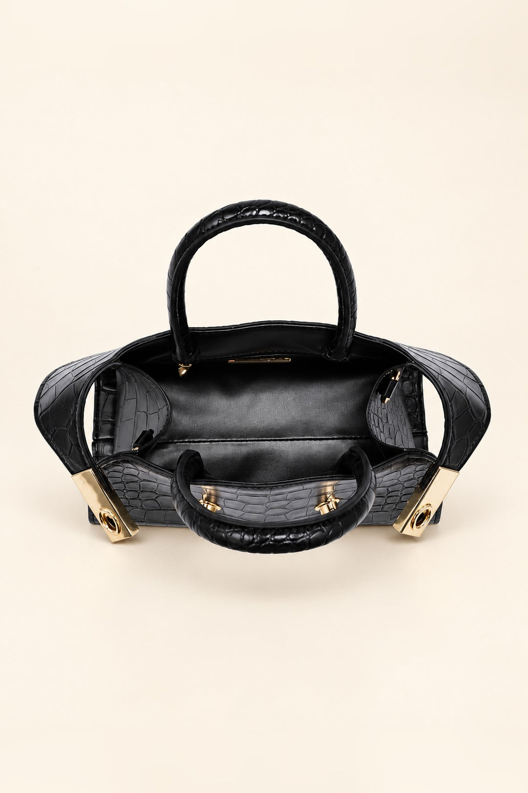 Lined interior of the black Fable crossbody with zip pocket and open slip pocket
