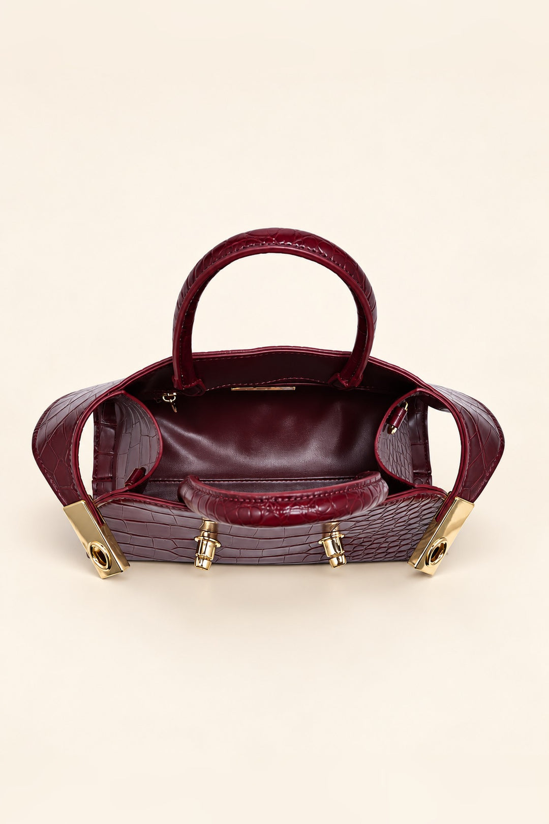 Lined interior of the burgundy Fable crossbody with zip pocket and open slip pocket