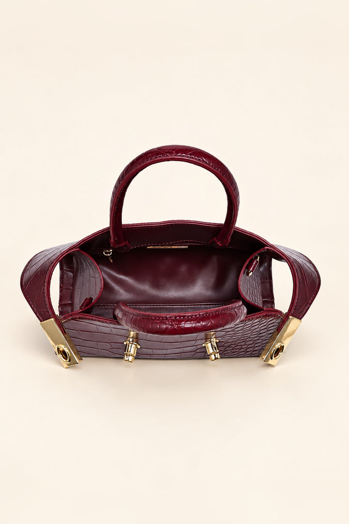 Lined interior of the burgundy Fable crossbody with zip pocket and open slip pocket