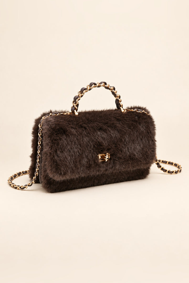 Chocolate brown faux fur crossbody at an angle showing its structured shape