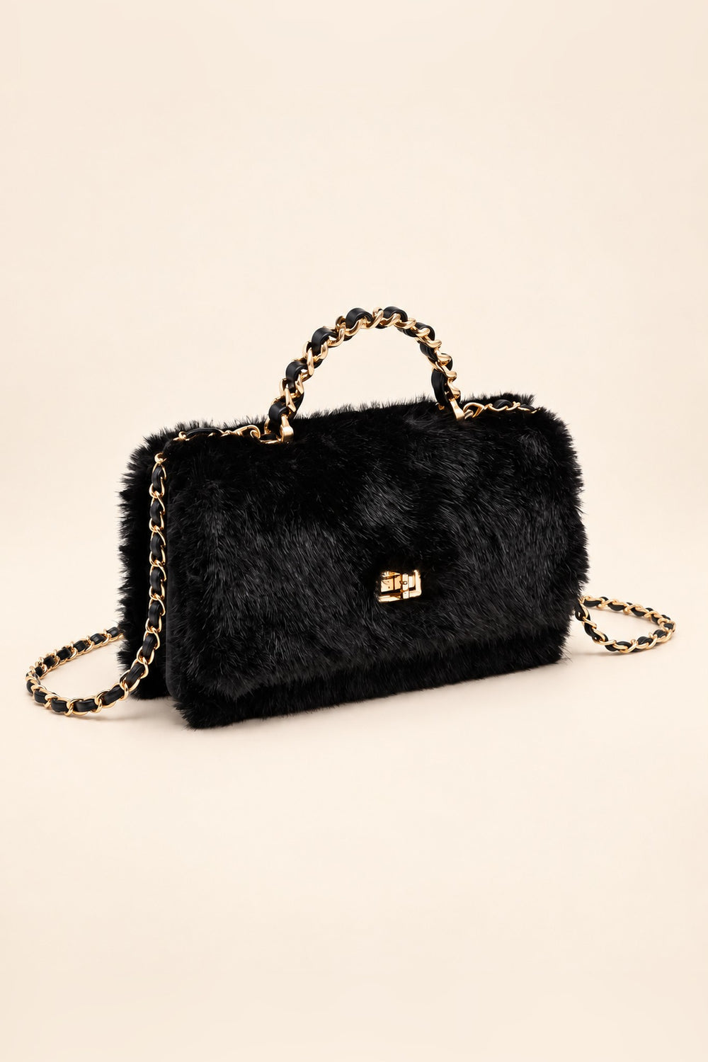 Black faux fur crossbody at an angle showing its structured rectangular shape