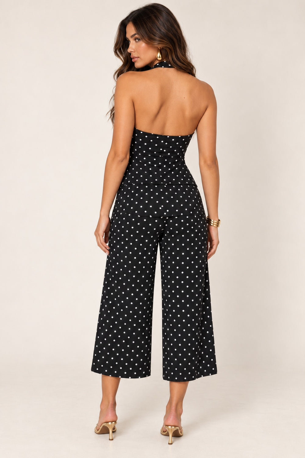Back view of the black polka dot wide-leg crop pants and halter top