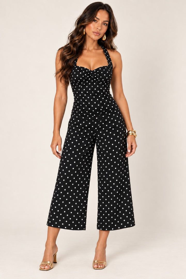 Black off-white polka dot halter top worn with the matching wide-leg crop pants, front view