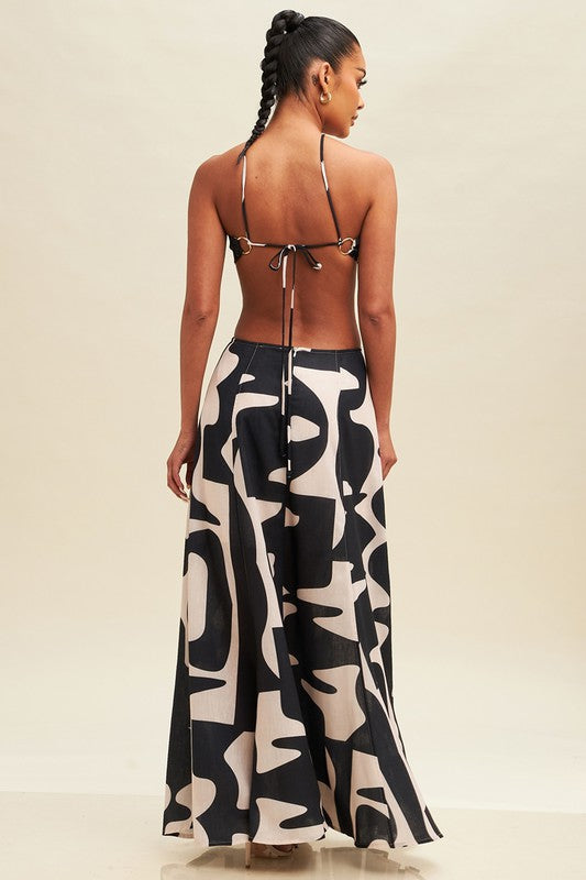 STYLED BY ALX COUTURE MIAMI BOUTIQUE Model is wearing Tauple Black Linen Abstract Ring Dress back view