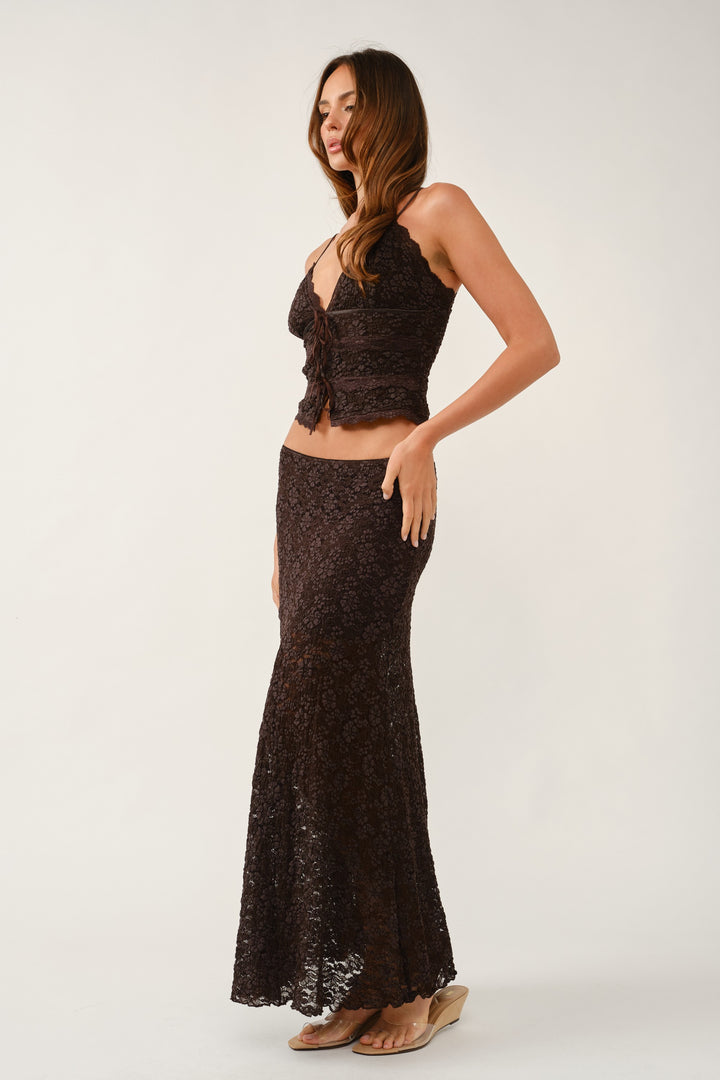 Three-quarter view of the brown floral lace cami with ribbon tie front, styled as a set with the lace maxi skirt