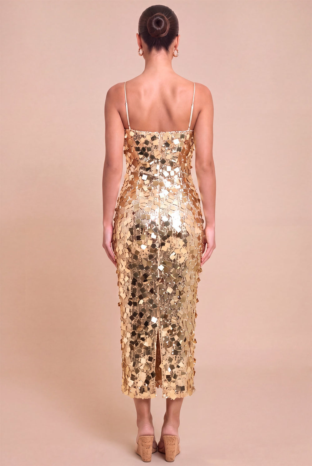 Back view of Luxxel gold sequin midi dress showing zipper and back hem slit