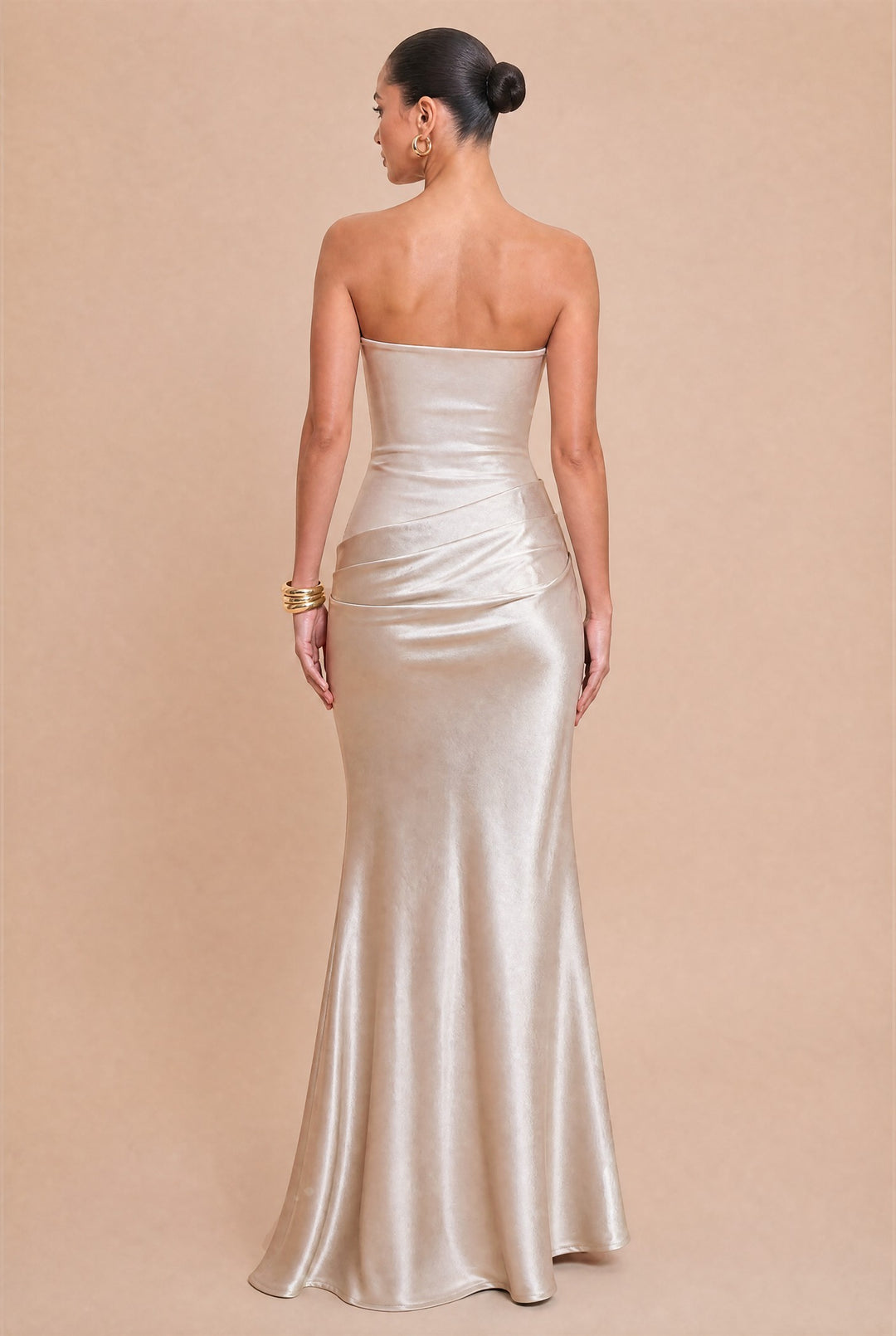 Back view of Luxxel rose champagne strapless satin maxi dress with gathered hip detail