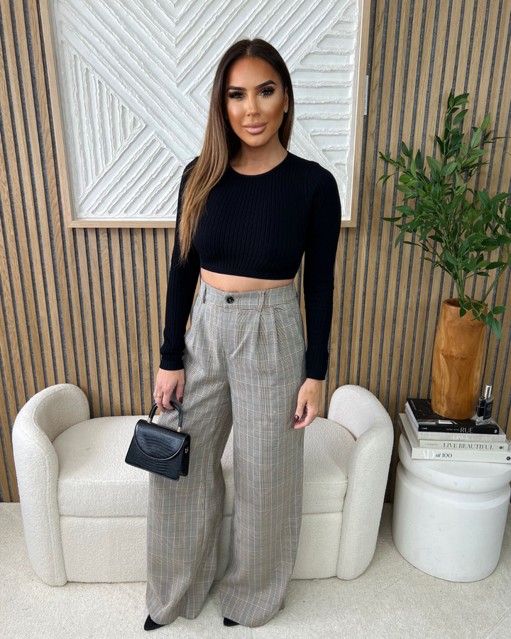 STYLED BY ALX COUTURE MIAMI BOUTIQUE Black Ribbed Crop Round Neck Long Sleeve Crop Top Paired With Beige Burgundy Plaid Double Pleated Front Trouser 