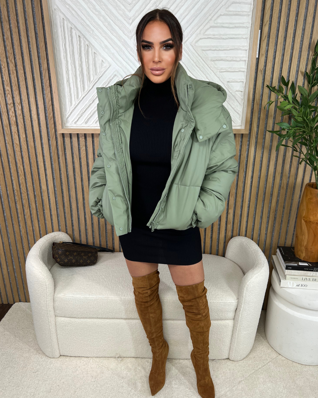 STYLED BY ALX COUTURE MIAMI BOUTIQUE Black Long Sleeve Turtle Neck Sweater Mini Dress Paired With Sage Living In This Puffer Jacket