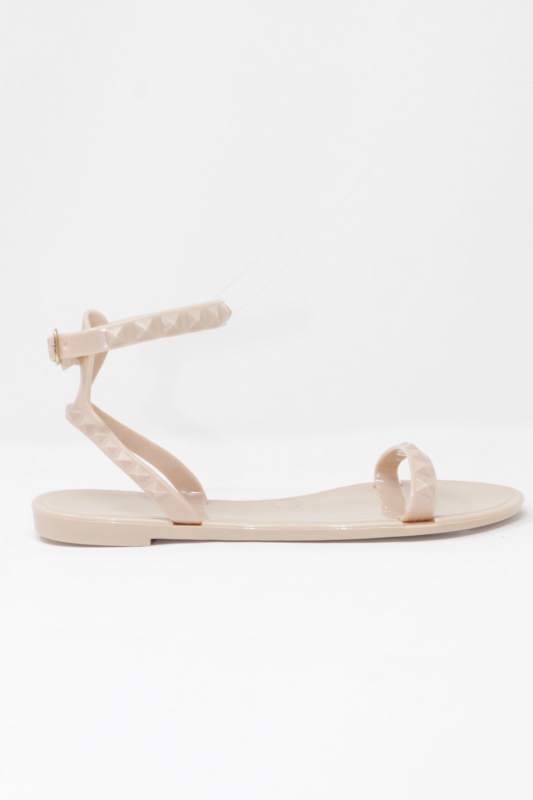 Aria Kids nude jelly sandal with a thin strap across the toes and a thin strap around the ankle.