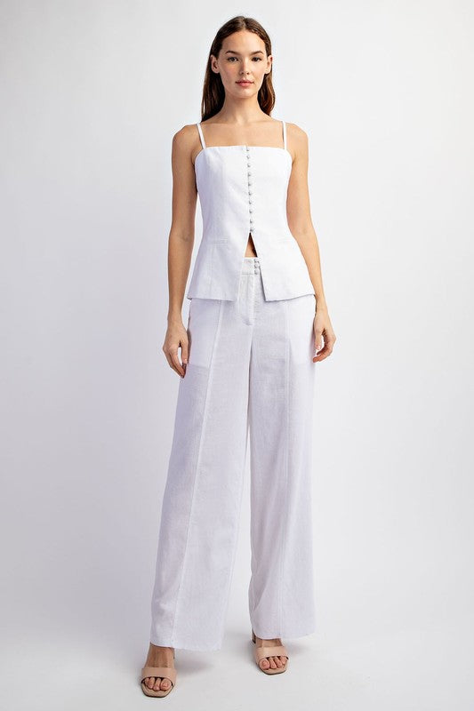 model is wearing Off White Stretch Linen Tailored Tube Top with matching pants with beige heels 