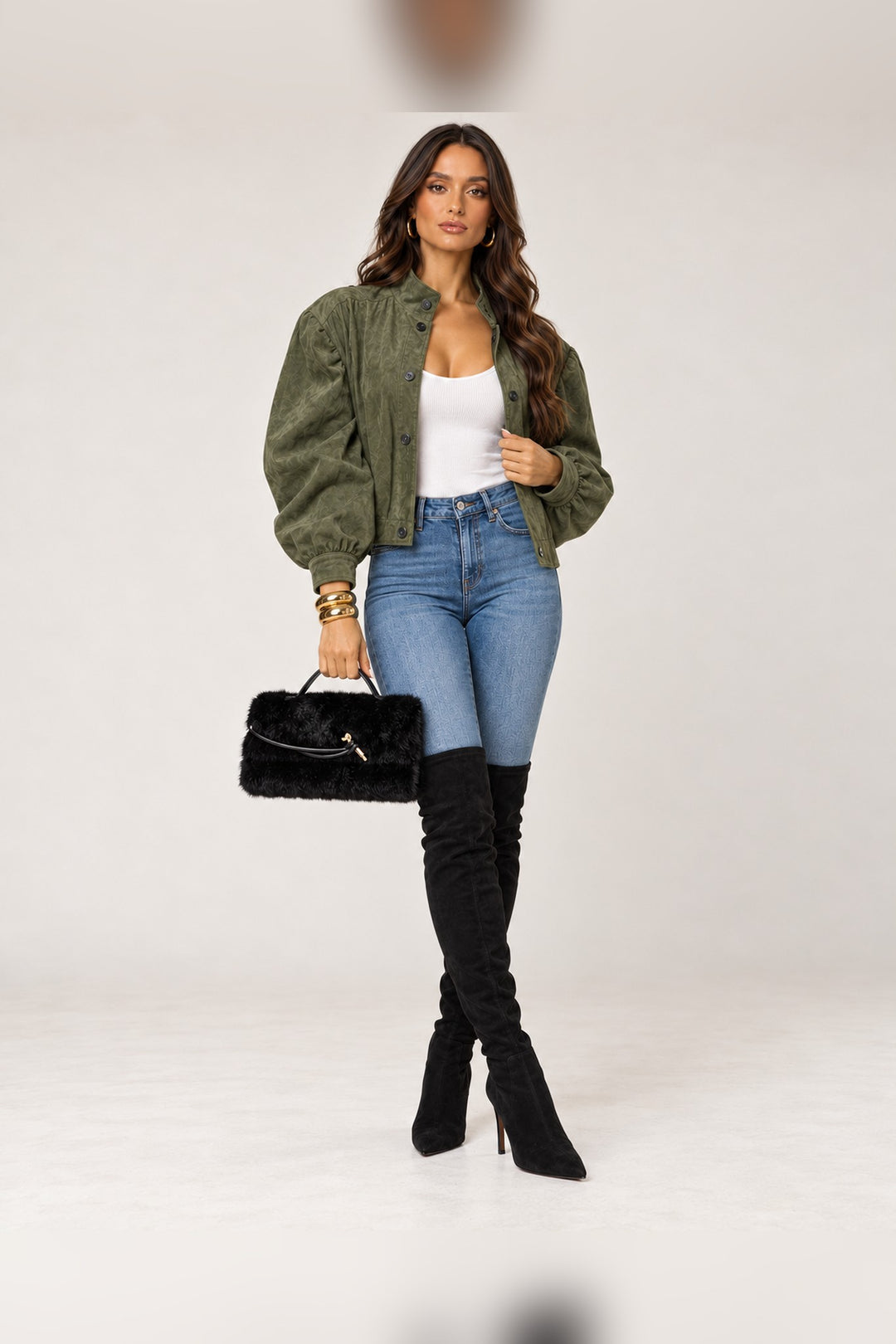 Full-length look with the black faux fur Ada bag held by its top handle, a Christmas party look