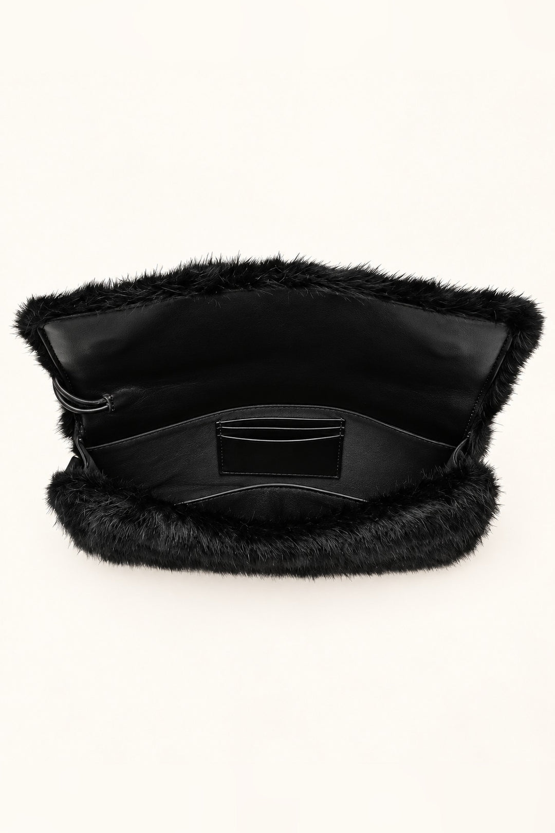 Open black Ada faux fur bag showing lined interior, slip pocket and card slots
