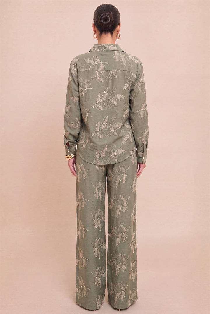 Back view of Luxxel olive matching set showing the leaf embroidery and long-sleeve shirt