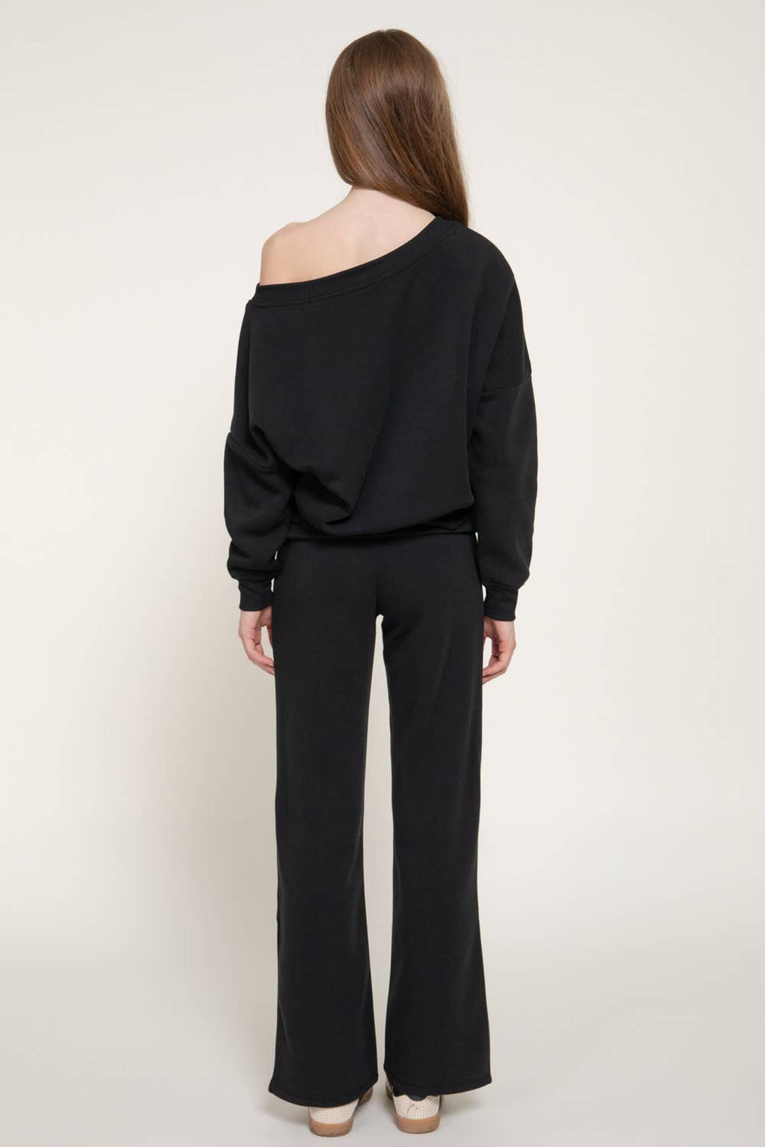 Back view of the black asymmetrical neck sweat set showing the relaxed fit, a Thanksgiving weekend outfit