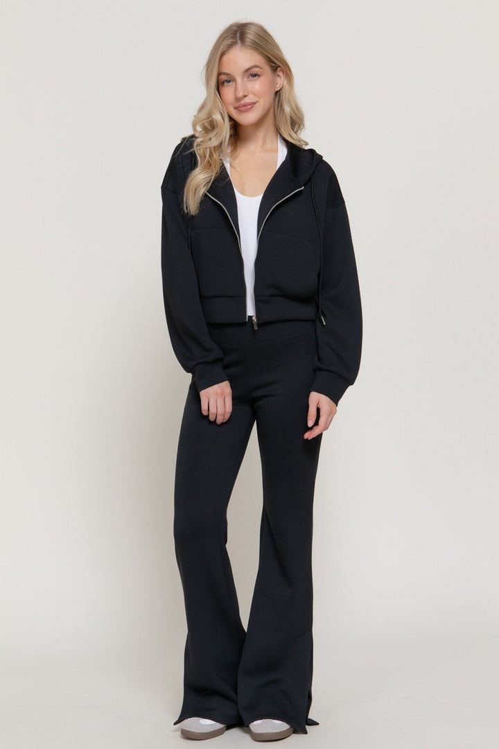 Black scuba flare pants worn as a set with the black soft scuba hoodie jacket
