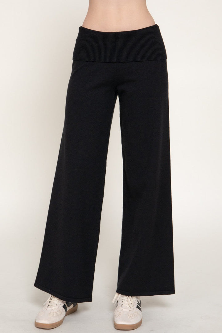 Front view of the black fold over waist knit pants, a Thanksgiving travel outfit