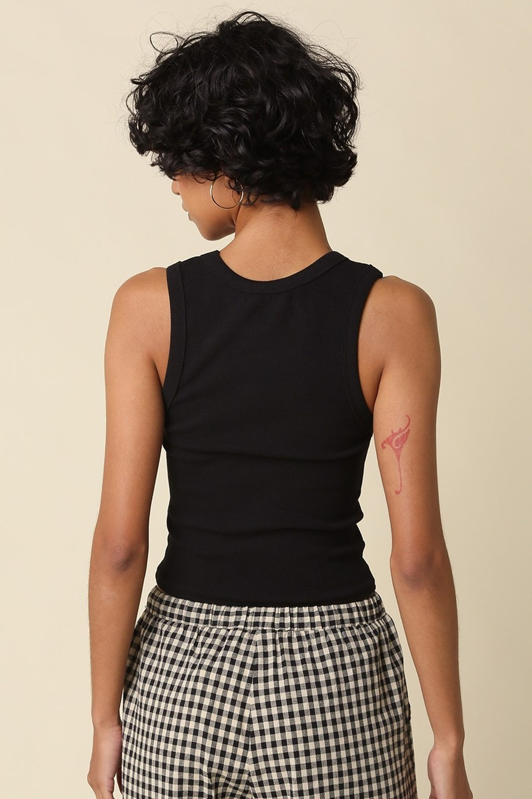 Black Jane crop tank worn with pants, full length