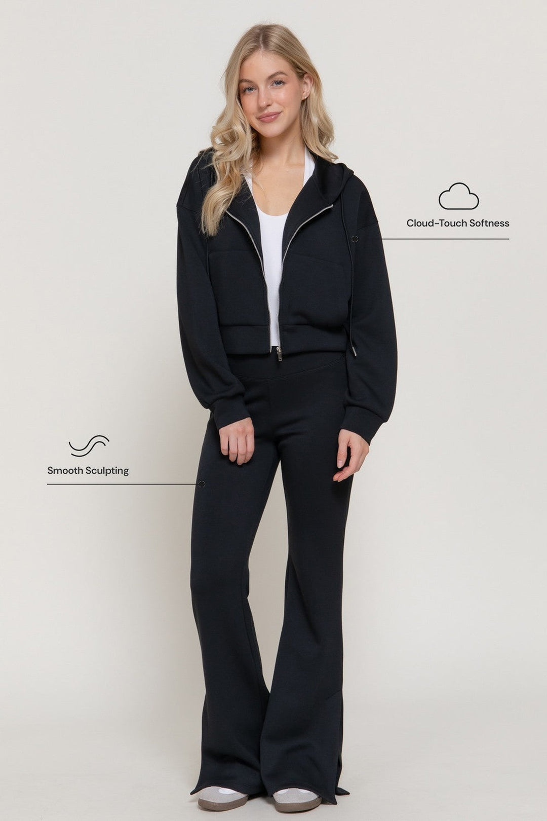 Black hoodie jacket worn as a set with the black flare pants