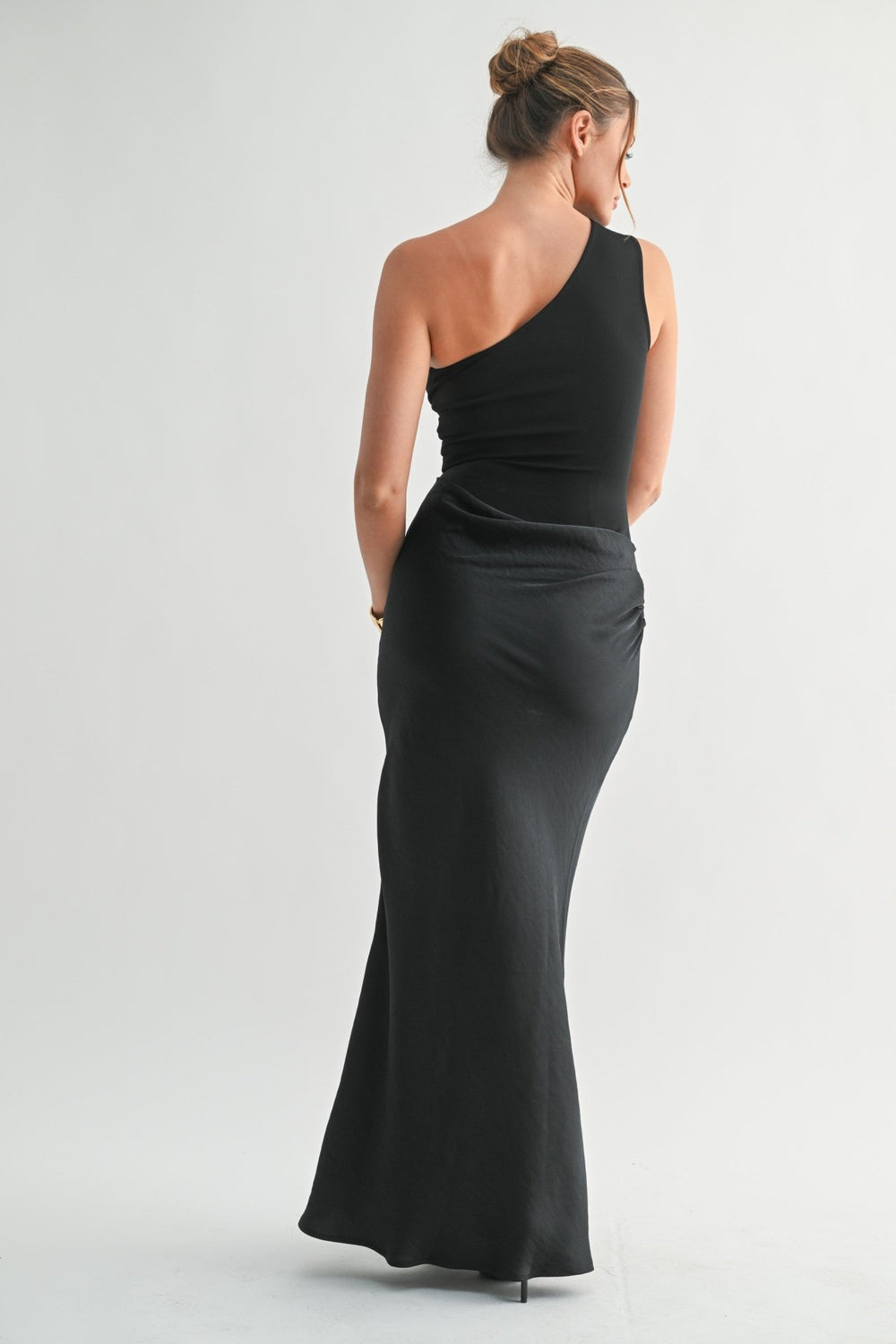 Smooth structured bodice of the black one shoulder dress