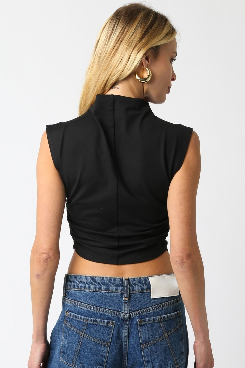 Black mock neck ruched crop top, back view