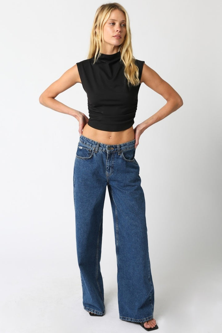 Black Sarah cropped top worn with jeans, full length