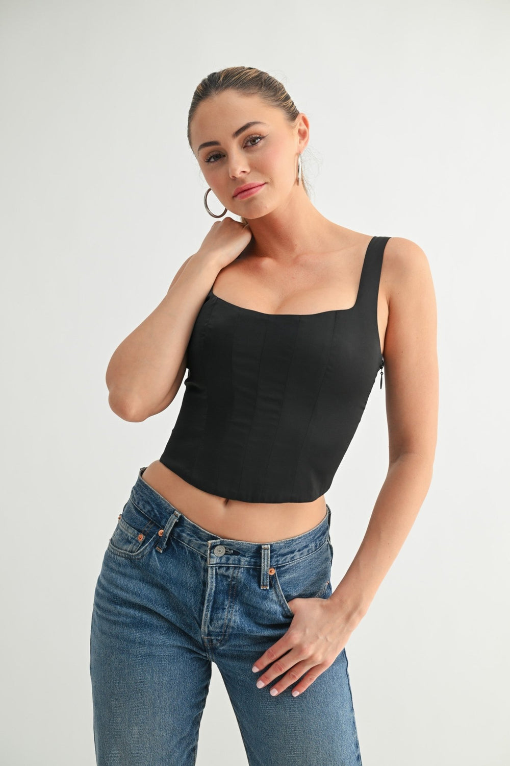 Lace-up back detail on the black corset crop top