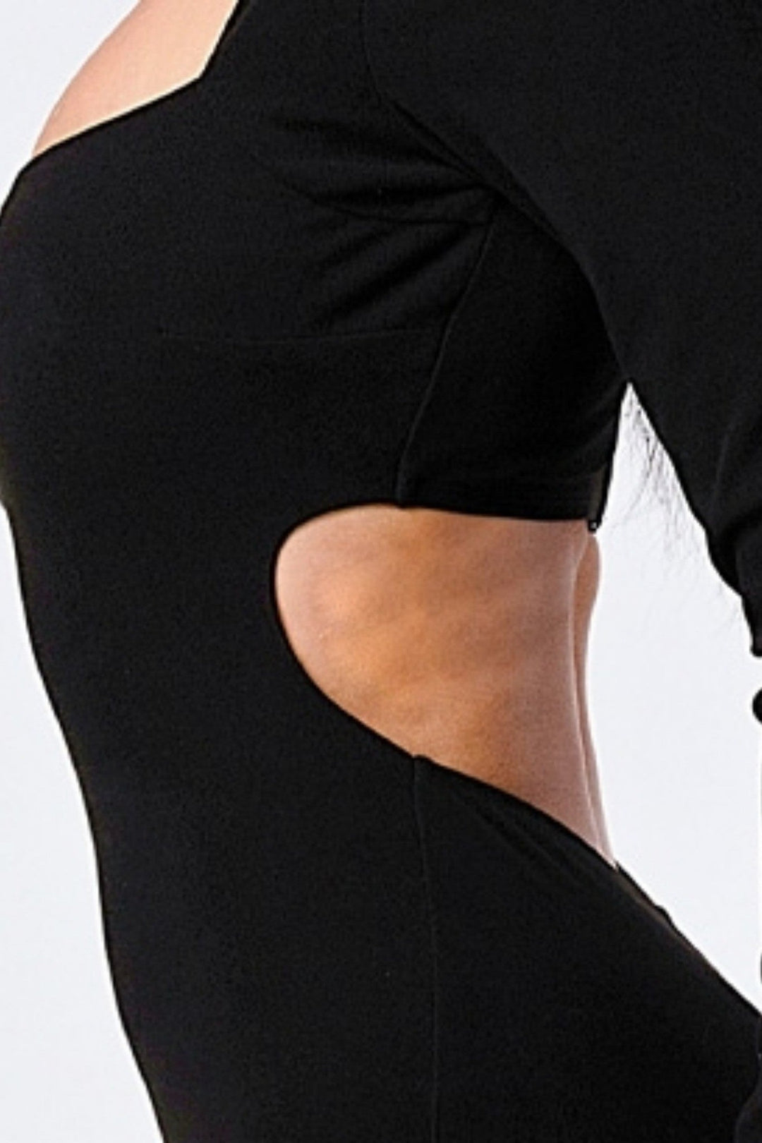 Close up of the side cutout detail on the black square neck bodycon mini dress