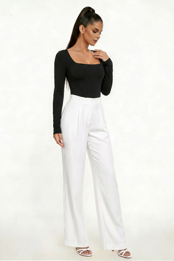 Black long sleeve ribbed bodysuit, three-quarter view