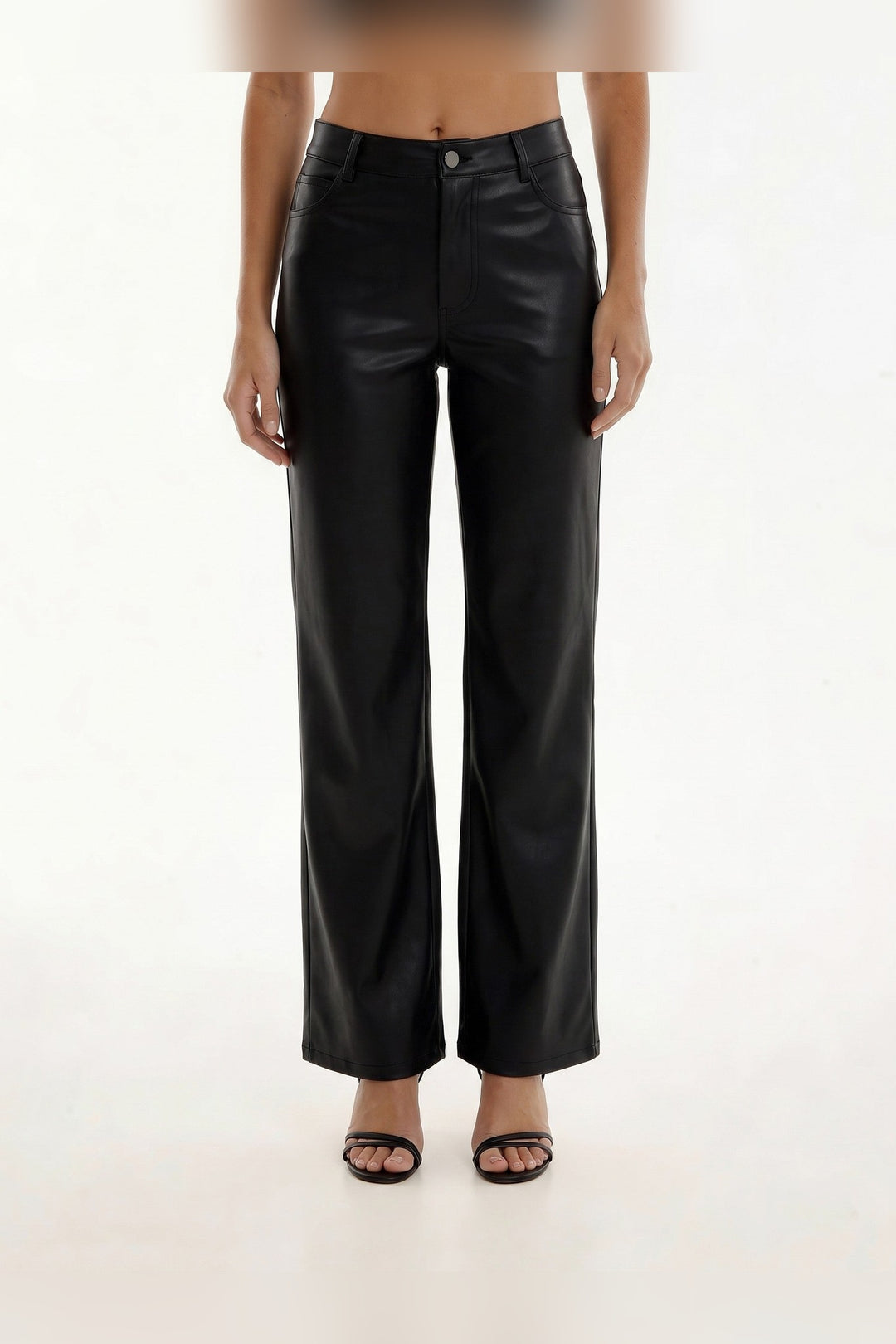 Black straight leg faux leather pants, side view