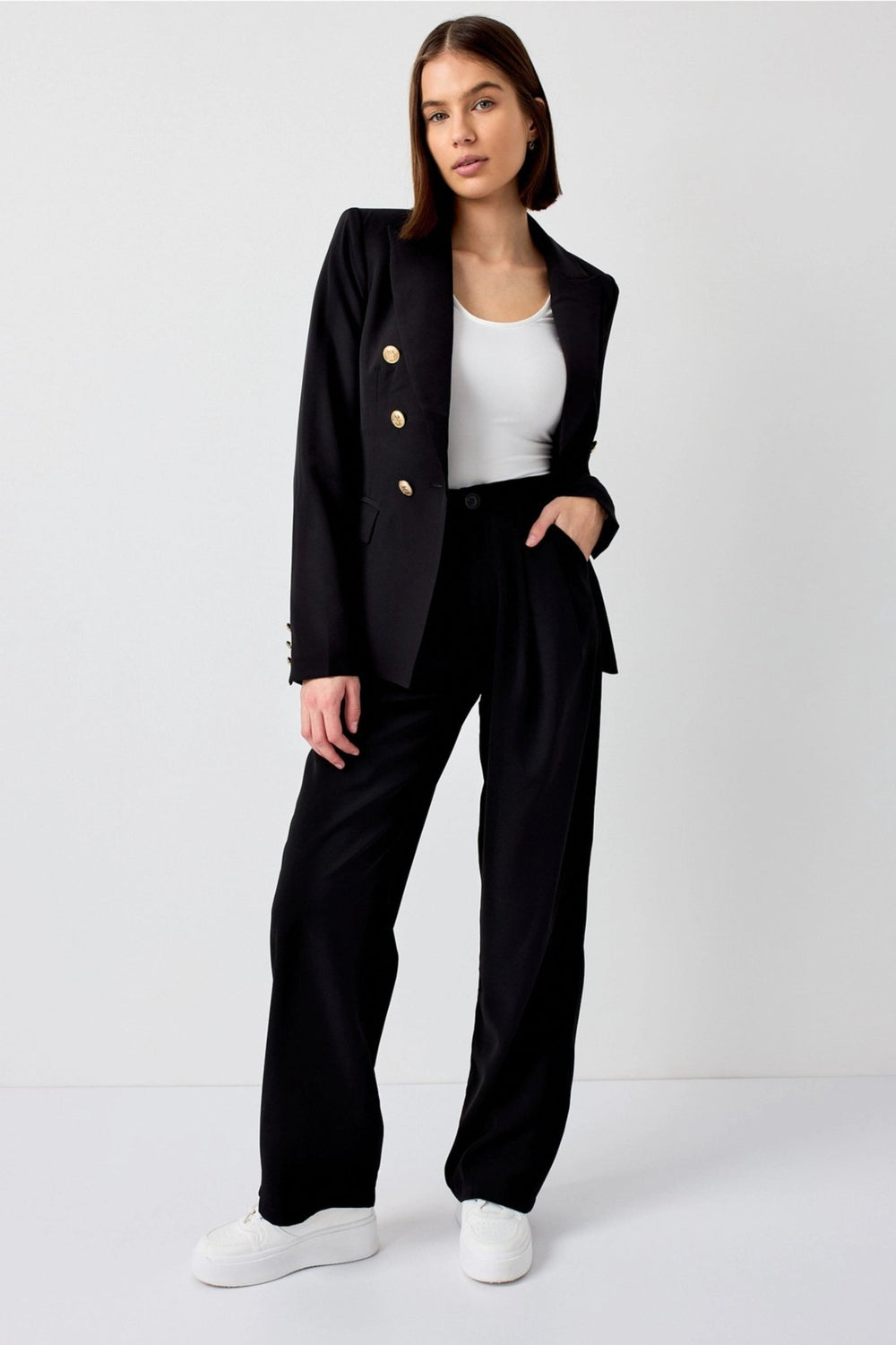 Tailored black blazer in a lightweight polyester blend fabric