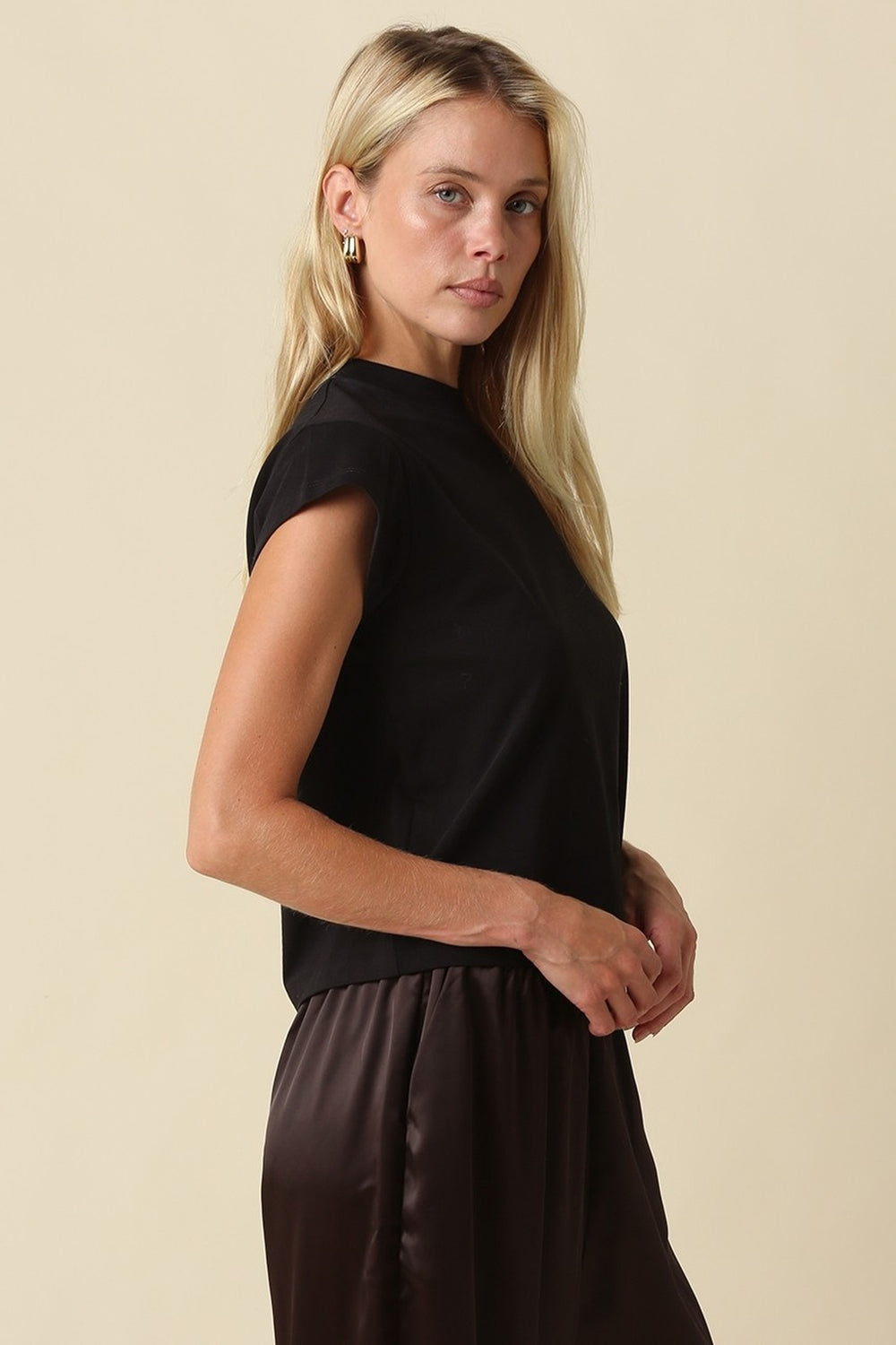 Black mock neck crop tee, three-quarter view