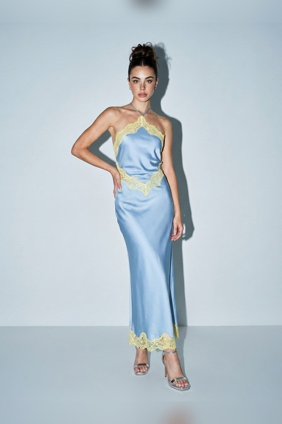 Light blue satin halter tie maxi dress with contrast lace trim, front view