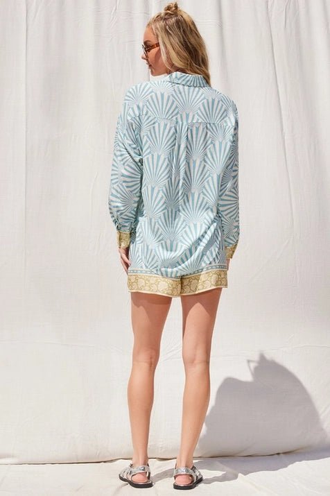 Fan-like aqua and ivory stripe print with a baroque style gold border