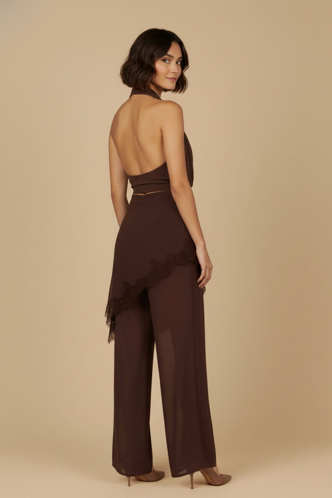Back view of the brown halter lace pants set showing the open back halter top and flowing pants