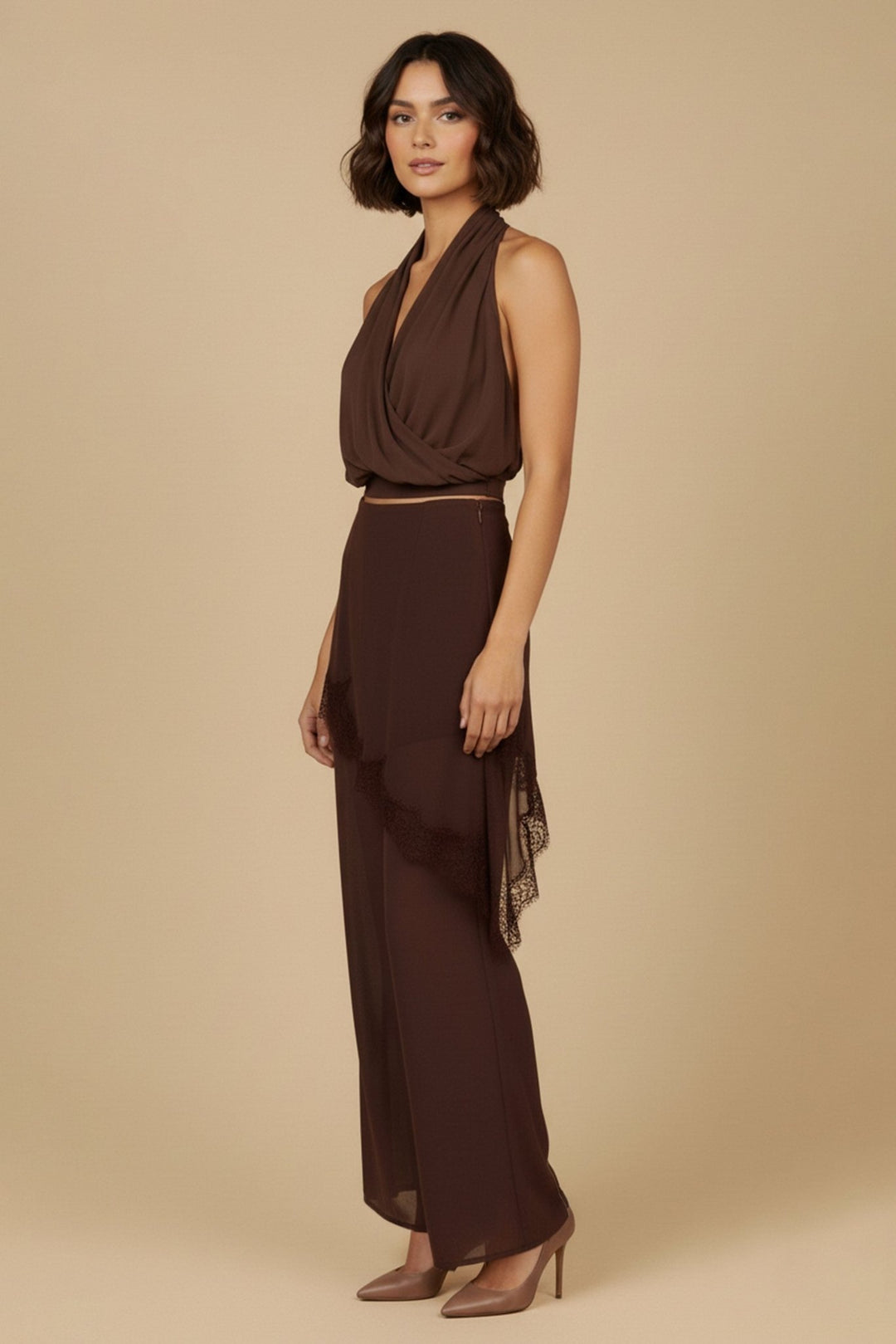 Side view of the brown draped halter top and lace trim pants set with nude heels
