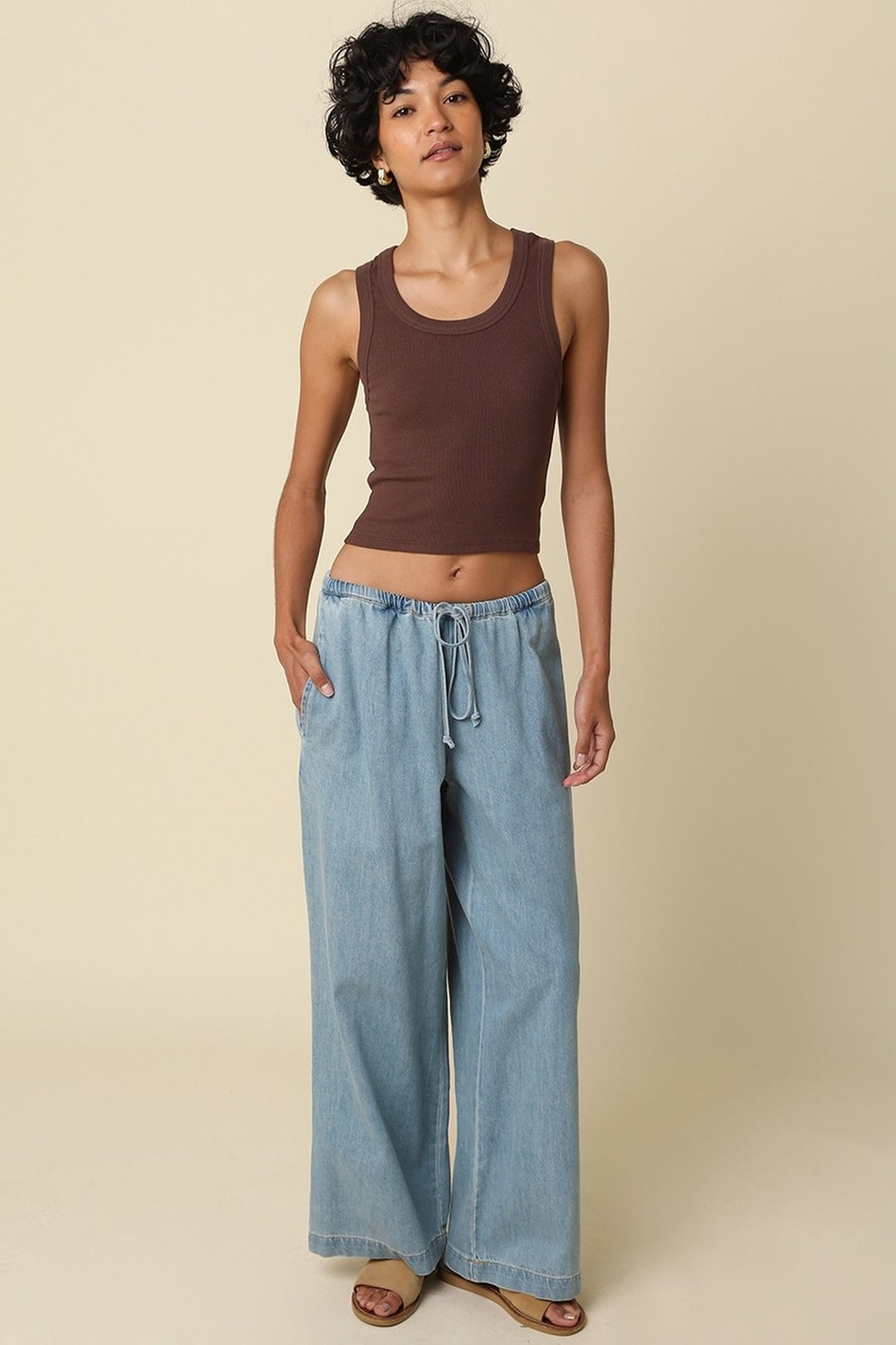 Brown Jane crop tank worn with pants, full length