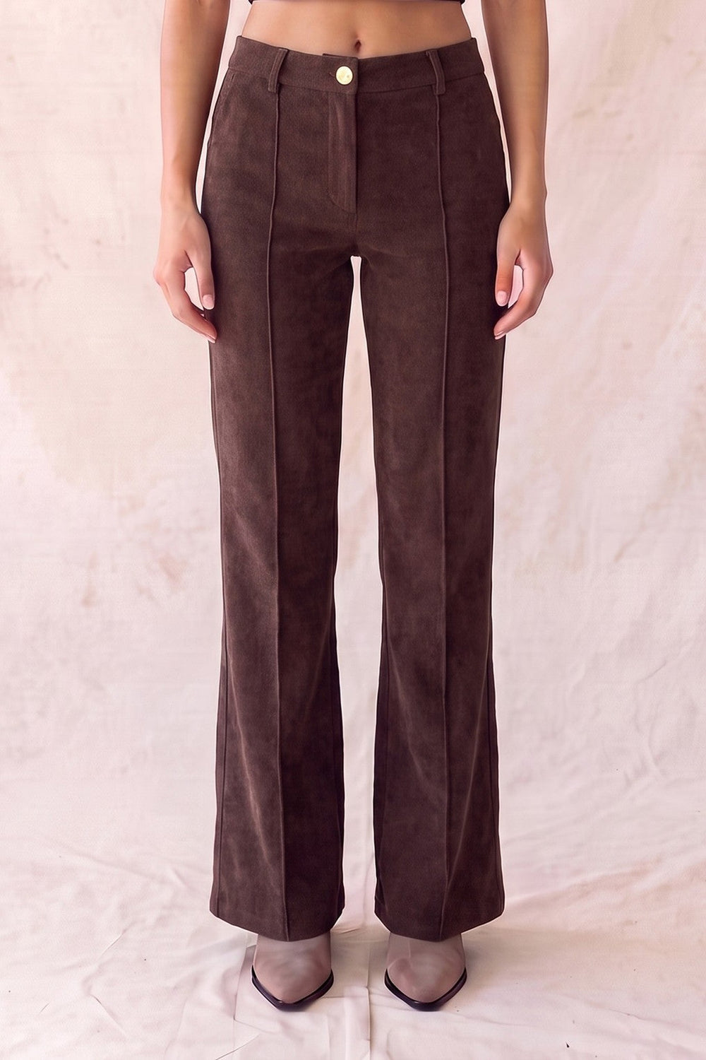 Brown pintuck wide leg pants with metallic button, front view