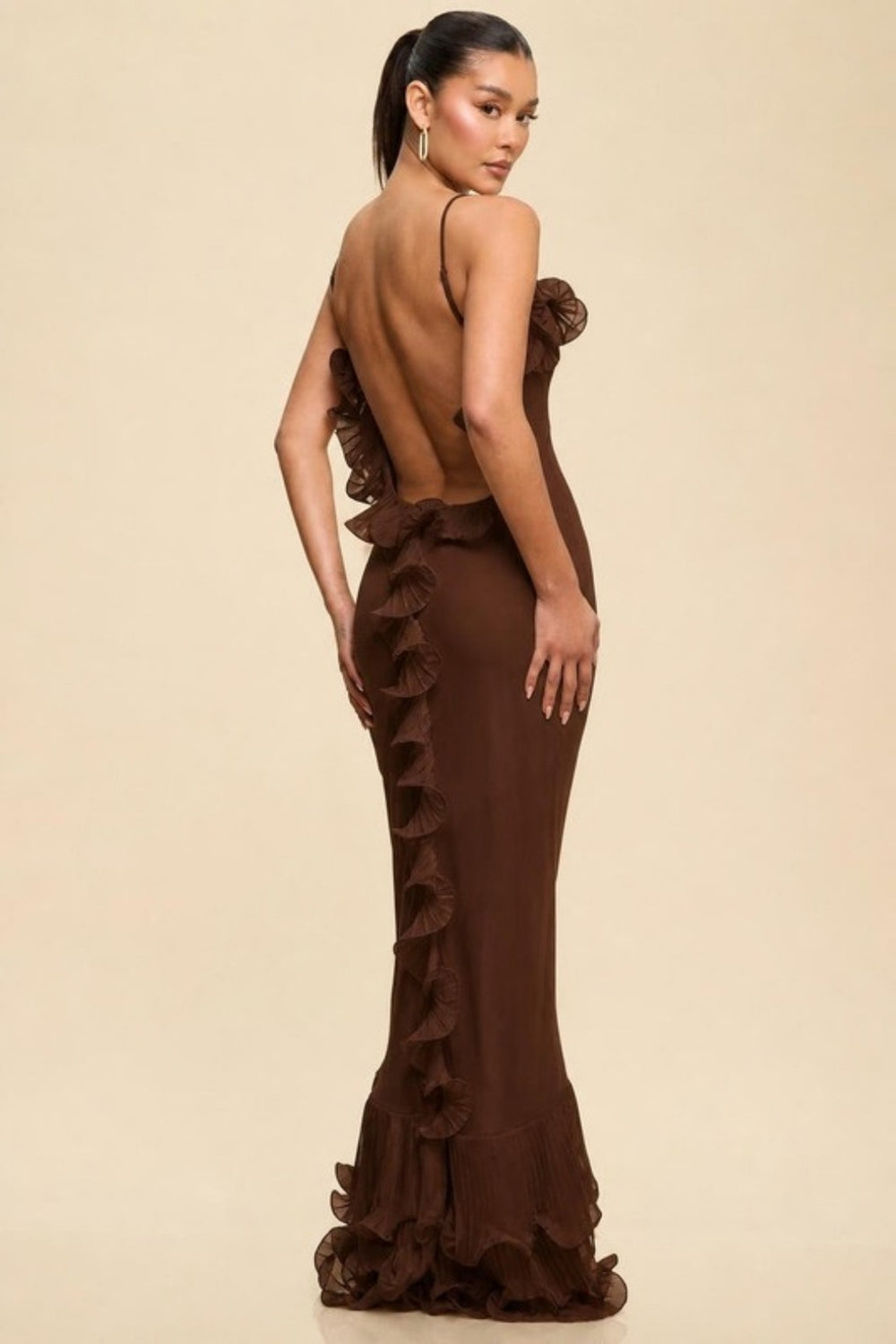 Brown ruffled maxi dress showing the open back and cascading ruffle trim, back view