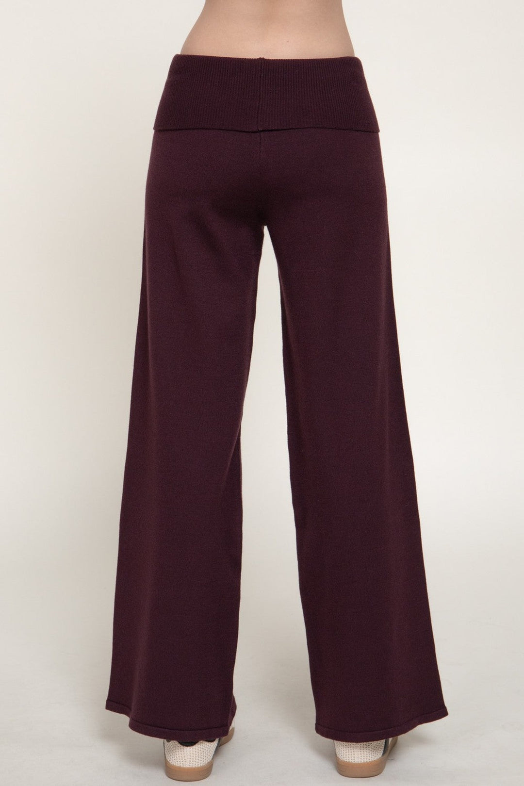 Back view of the burgundy fold over waist sweater pants with wide leg hem