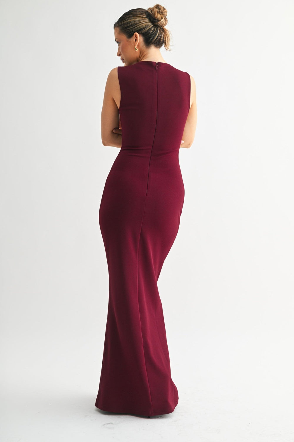 Gently flared hem on the burgundy sleeveless maxi dress