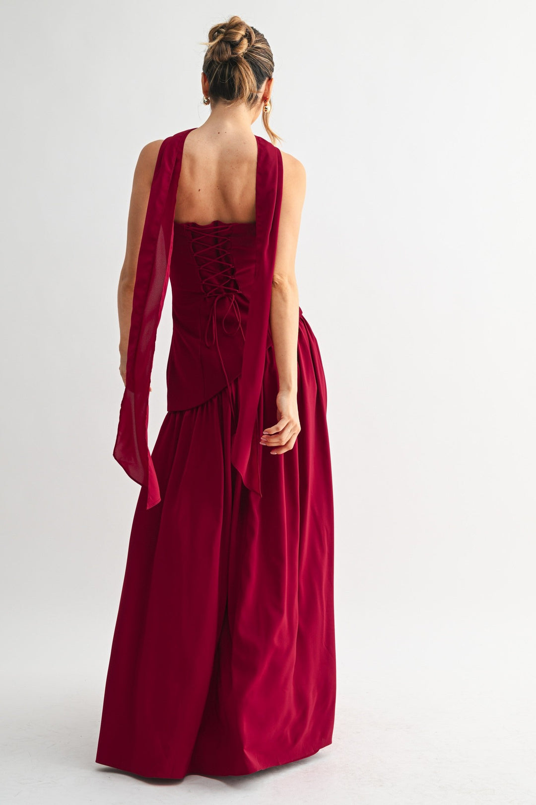 Burgundy strapless maxi dress, back view with corset lace-up