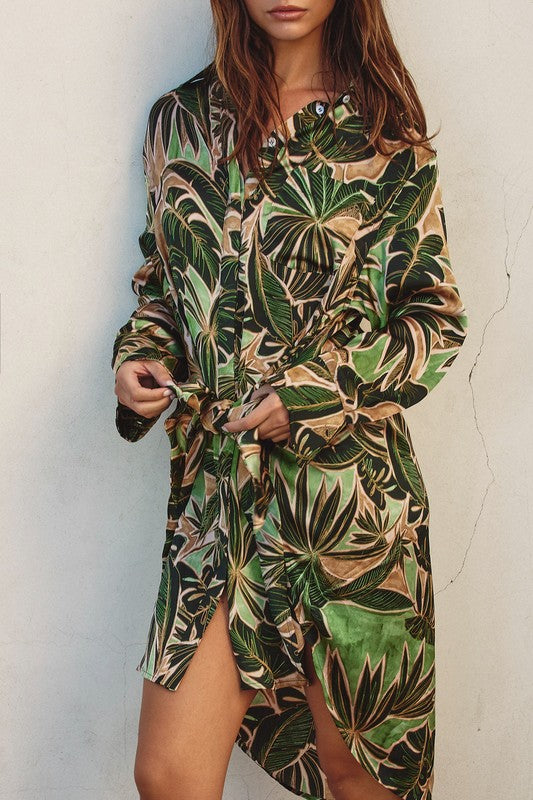 model is wearing Green Tropical Tie Shirt Dress  close up view of the print 