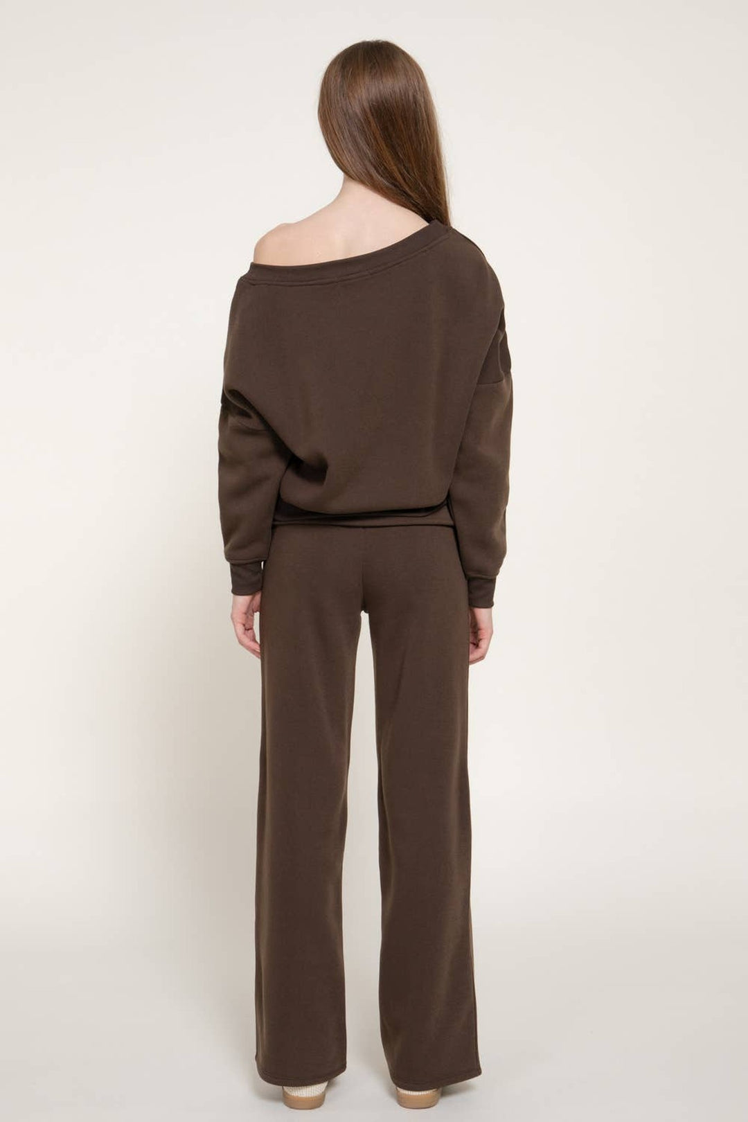 Back view of the chocolate brown asymmetrical neck sweat set showing the relaxed fit