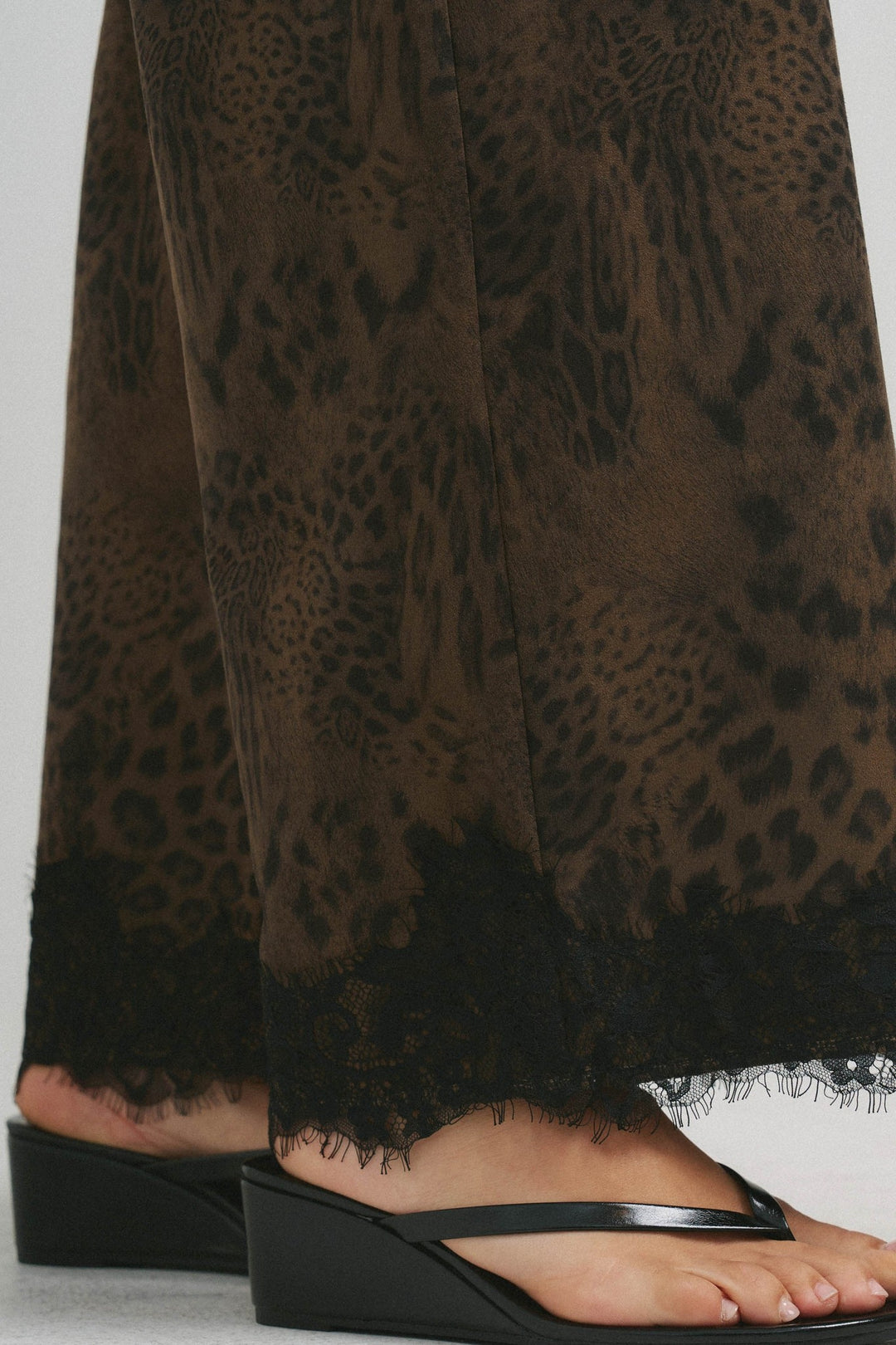 Close up of the lace trim hem on the brushed leopard pants