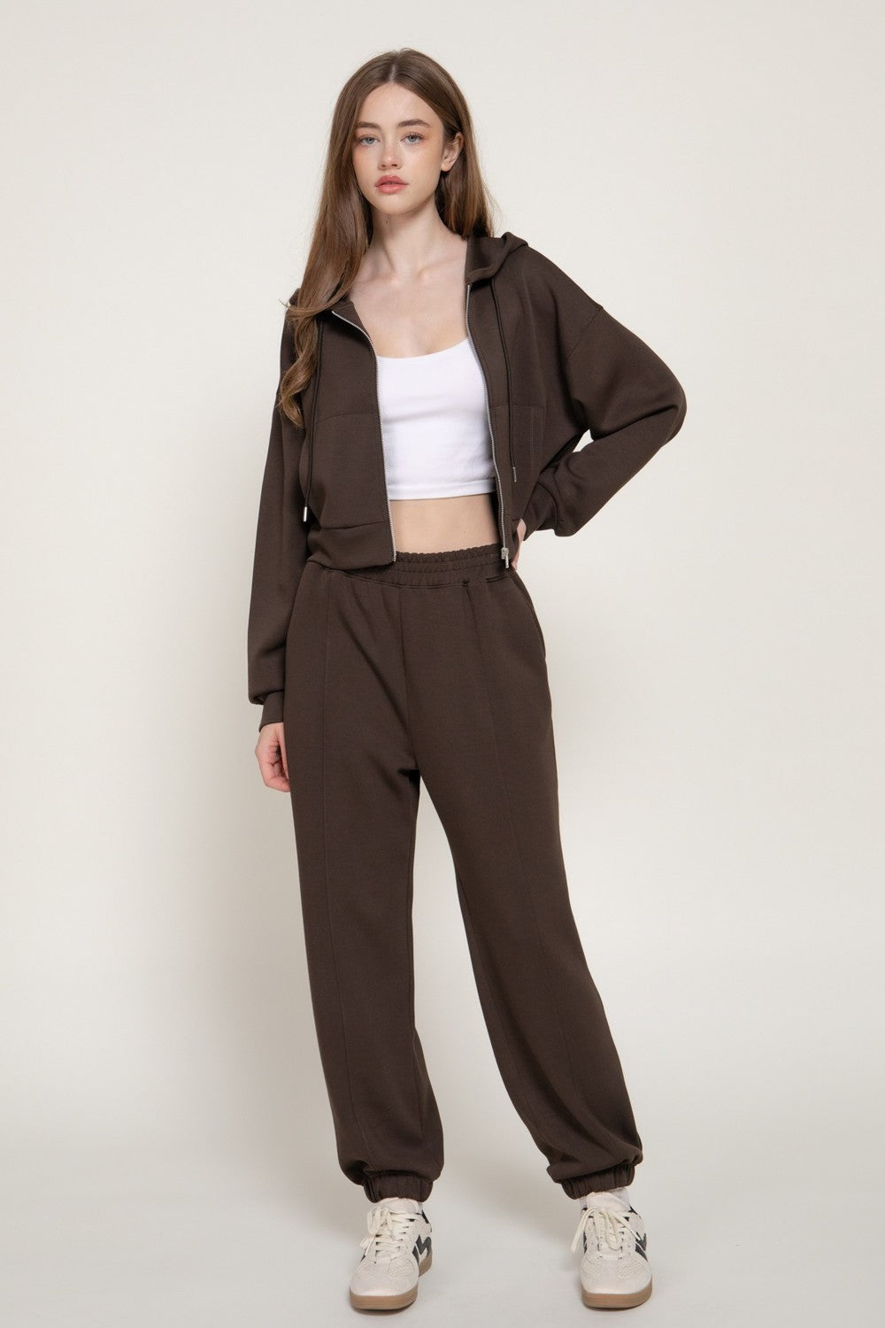 Dark brown joggers worn as a set with the dark brown hoodie jacket